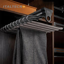 Referencing V Shape pants rack 1.jpg, a grey top-mounted L-shape pants rack is pulled out in a dark wardrobe, holding a pair of dark grey trousers. V Shape pants rack 2.jpg shows a close-up of the cold-rolled steel hooks and the soft cylinder flocking sponge tubes. V Shape pants rack 3.jpg provides a macro view of the textured non-slip flocking sponge tubes with metal end caps. V Shape pants rack 4.jpg illustrates the internal damping buffer guide rail mechanism for smooth sliding. V Shape pants rack 5.jpg 