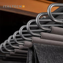 Referencing V Shape pants rack 1.jpg, a grey top-mounted L-shape pants rack is pulled out in a dark wardrobe, holding a pair of dark grey trousers. V Shape pants rack 2.jpg shows a close-up of the cold-rolled steel hooks and the soft cylinder flocking sponge tubes. V Shape pants rack 3.jpg provides a macro view of the textured non-slip flocking sponge tubes with metal end caps. V Shape pants rack 4.jpg illustrates the internal damping buffer guide rail mechanism for smooth sliding. V Shape pants rack 5.jpg 